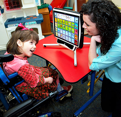 Children communicating using eyegaze with teacher